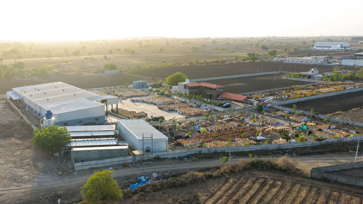 Aerial view highlighting the factory storage yard with cable drums